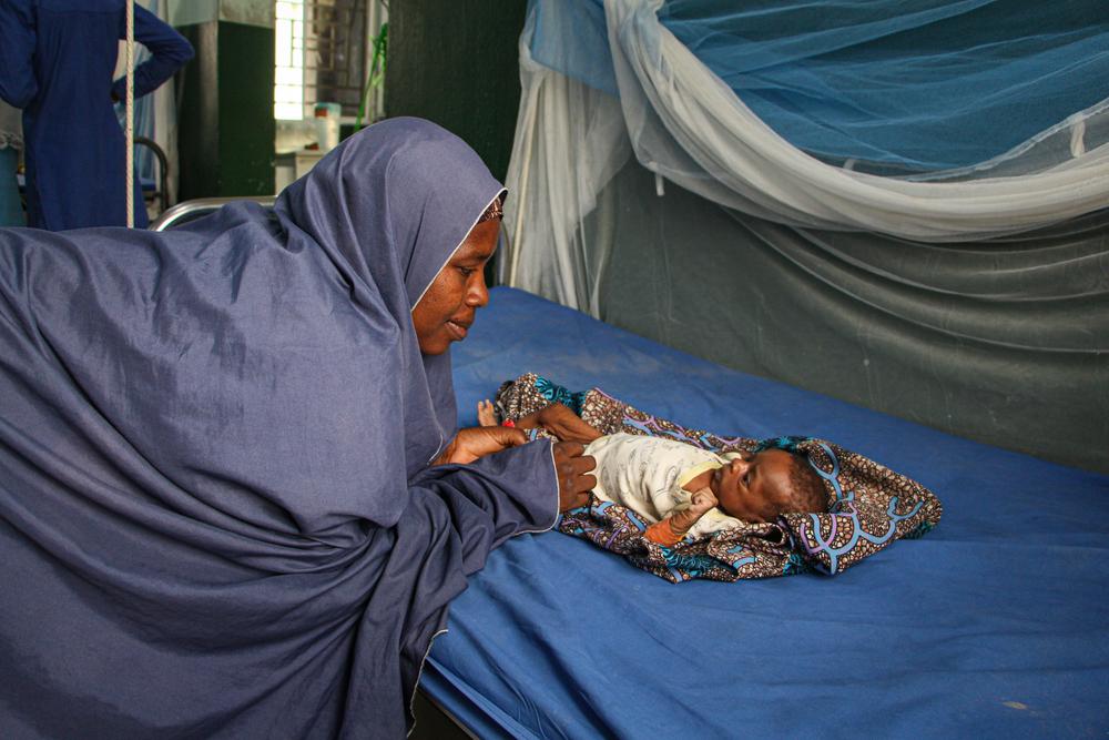 A mother looking at her child at the ITFC in General Hospital Zurmi, Zamfara state, Northwest Nigeria.