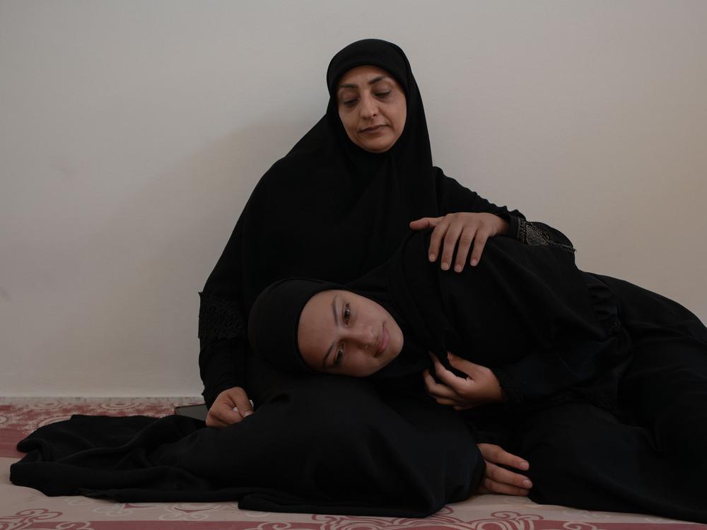 A Lebanese mother and daughter displaced by the war in Lebanon. Lebanon, October 2024. © Antoni Lallican/Hans Lucas