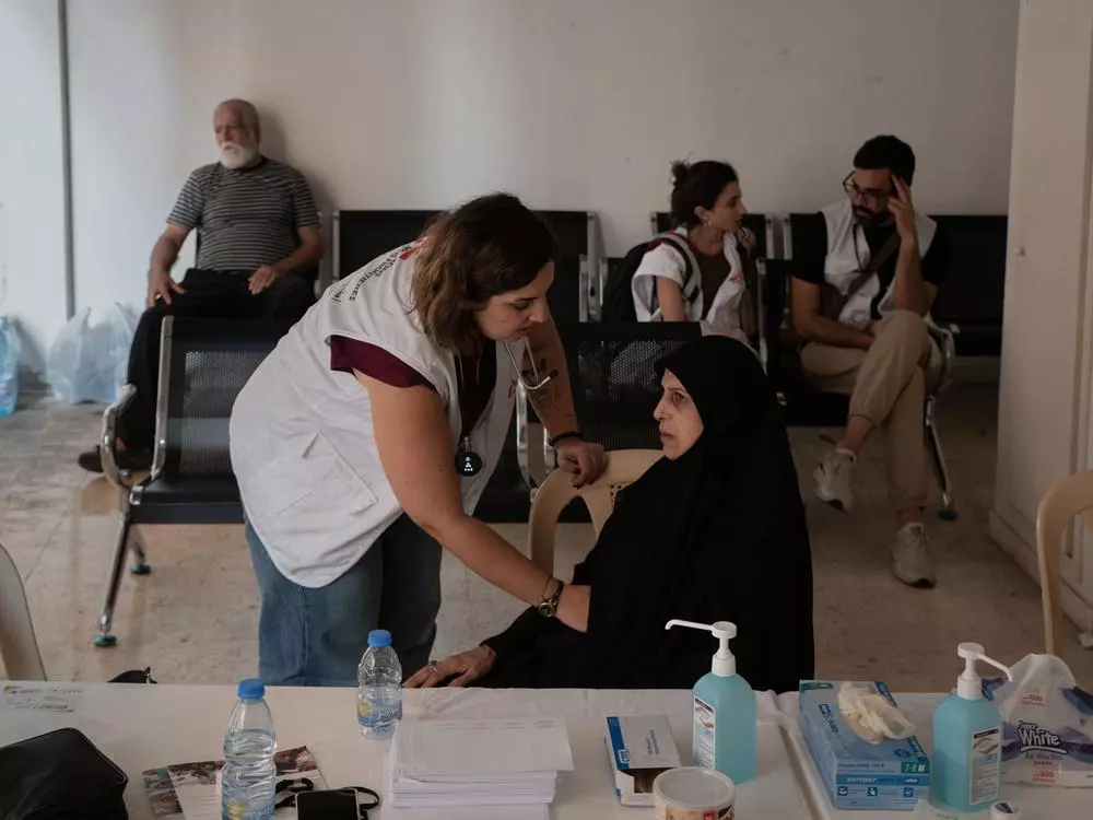 MSF medical team treated a patient in the Azarieh shelter in central Beirut. Lebanon, October 2024. © Antoni Lallican/Hans Lucas