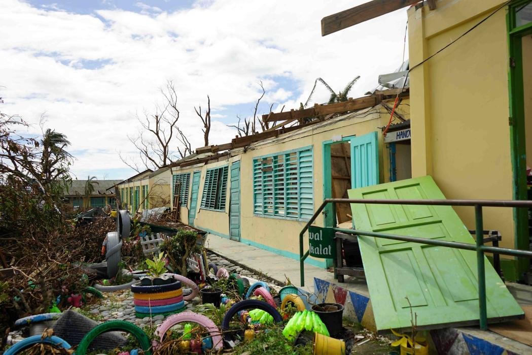 Some residents evacuated to Dinadiawan Elementary School during the storm, only to rooftops torn off the buildings, and trees breaking down cement walls