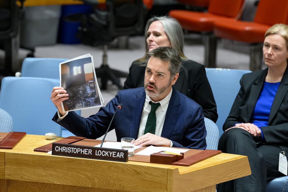 Christopher Lockyear, secretary general of Médecins Sans Frontières (MSF), holds up an image of the destroyed MSF shelter in Al-Mawasi in Khan Younis, Gaza in the UNSC meeting