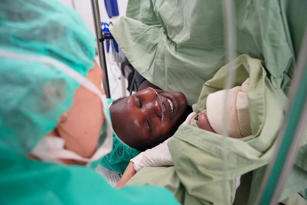 A mother meets her baby girl, Juan, during her caesarean section in Mundari County hospital, the only secondary healthcare facility in Kajo Keji, Central Equatoria state, South Sudan