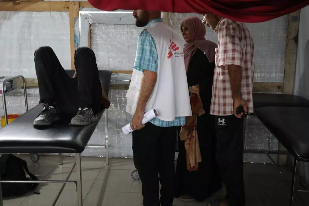 MSF staff helping wounded patient