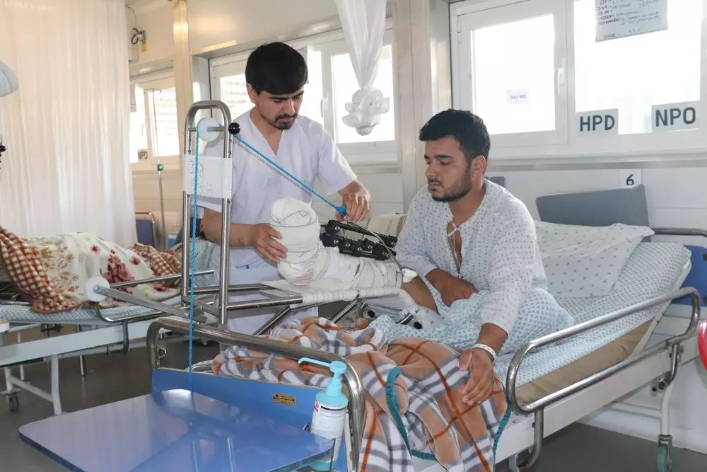 MSF nurse attending to patient