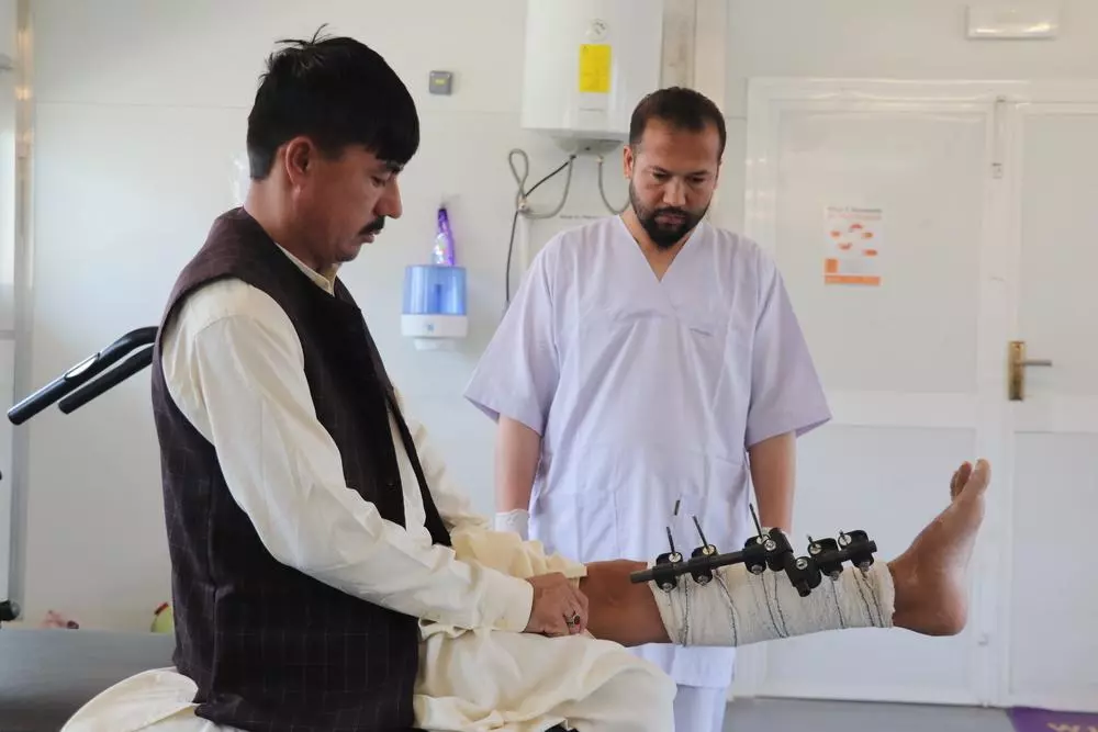 MSF physiotherapist with patient