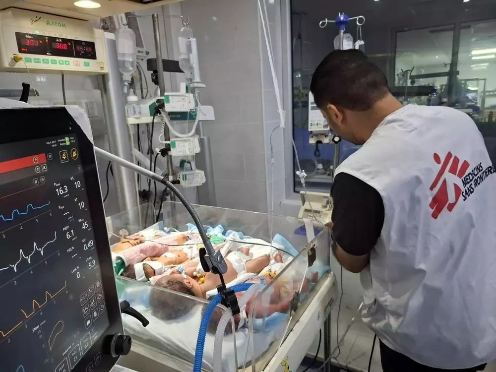 MSF staf with infant patients