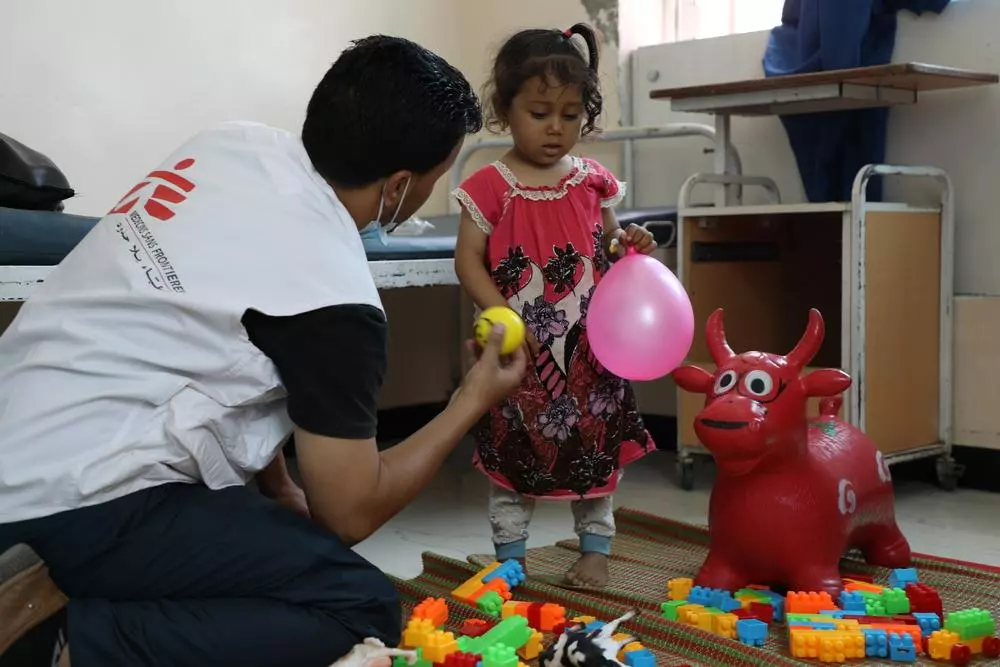 MSF staff with child