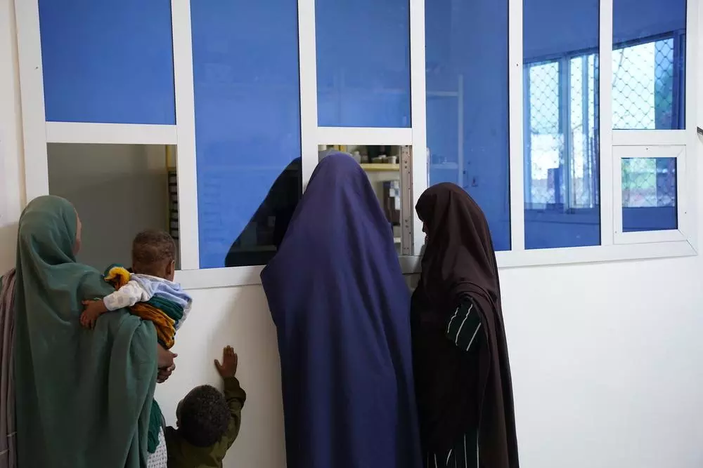 Patients lining up at pharmacy