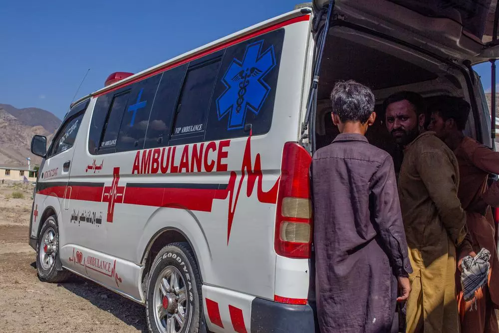 People at back of ambulance