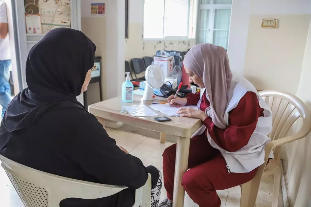 MSF staff with patient