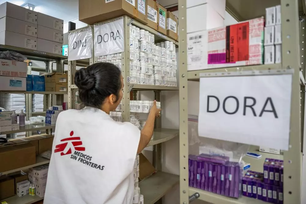MSF staff with supply of medicines