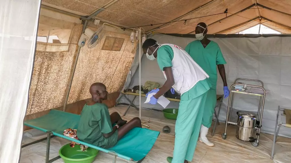 MSF clinician attending to patient