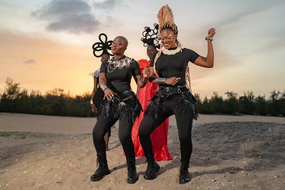 Def Mama Def perform during the "Clima Yaakaar" music video shoot near Lac Rose