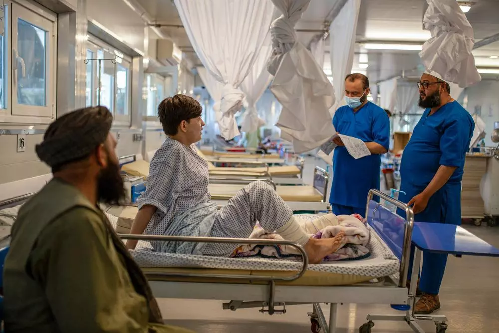 Medical staff check on the condition of a patient