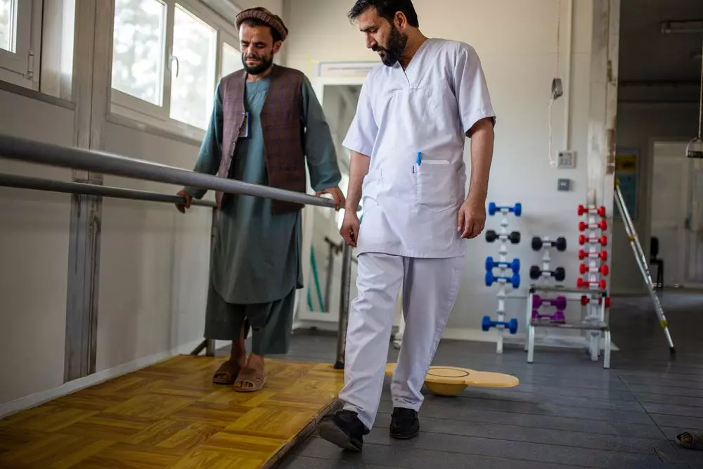 A physiotherapist assisting a patient during treatment