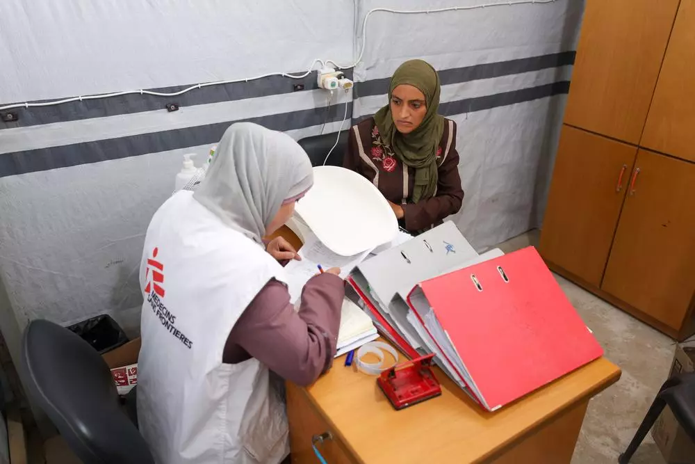 MSF nurse attending to patient