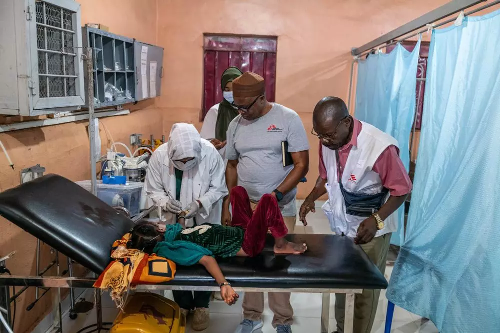 MSF staff attend to child patient