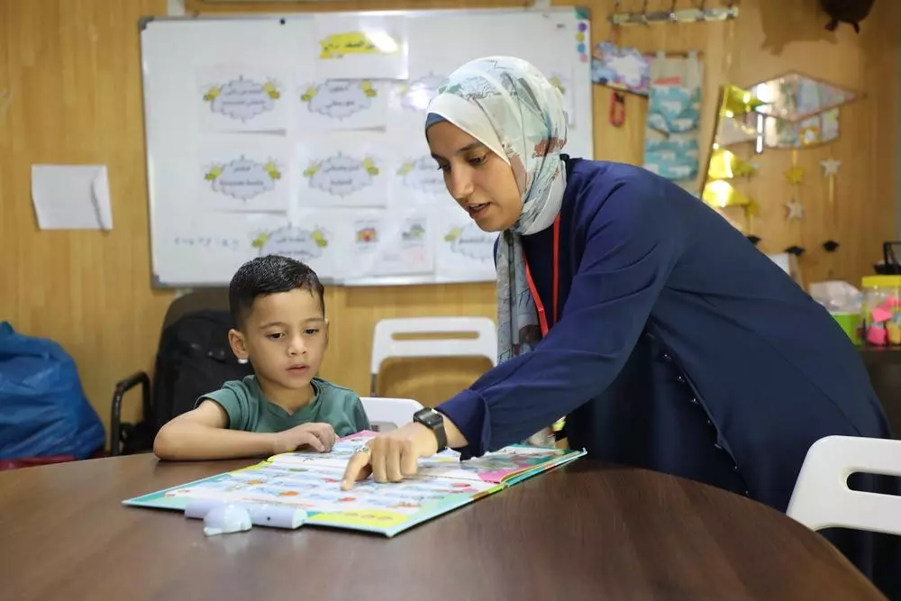 Child with teacher