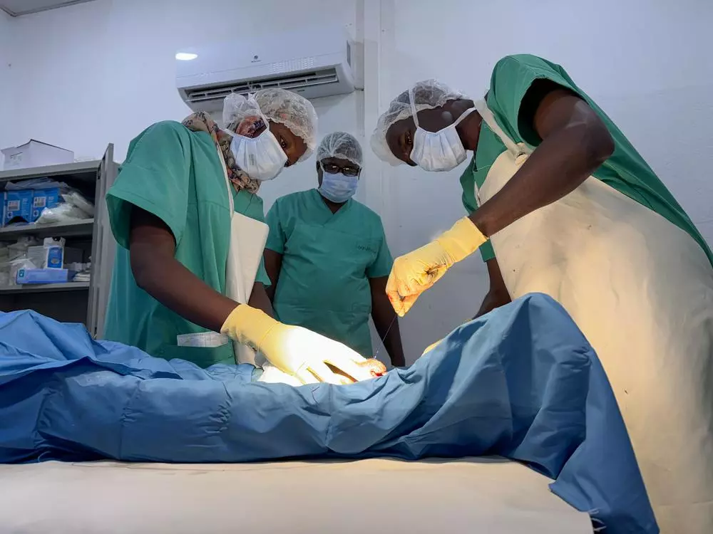 MSF surgeons operating on patient