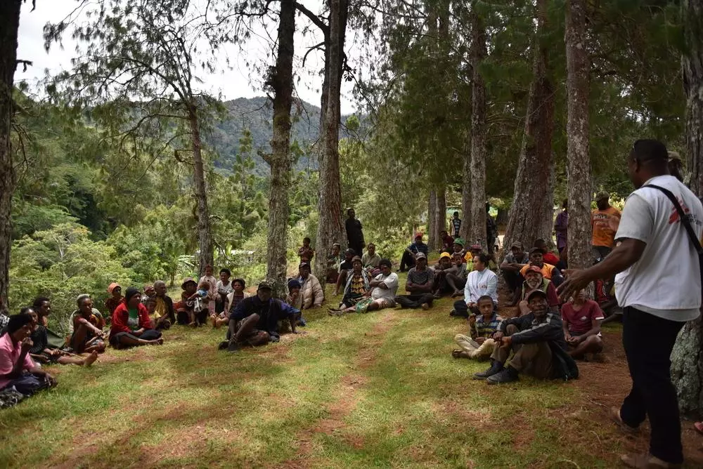 An MSF health promotion team talks to people in Mondumil village