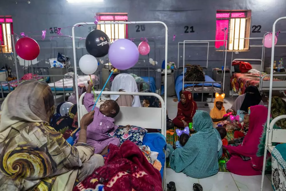 children take part in a mental health support session which uses balloons and toys, offering a rare moment of joy for young patients and displaced families living through the trauma of war