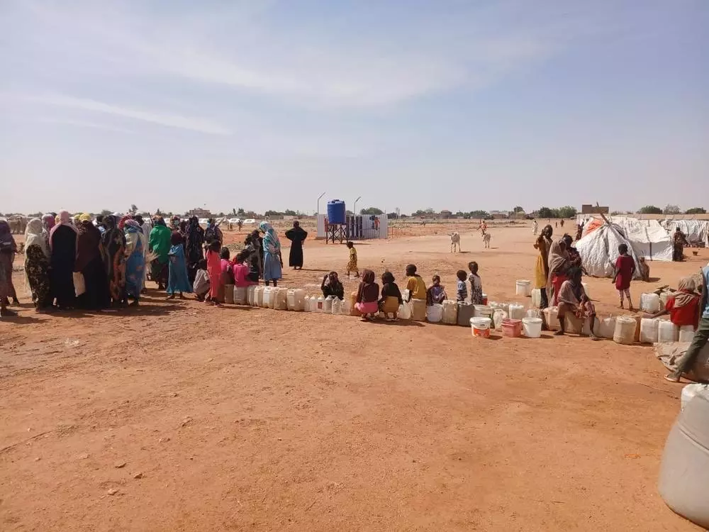 People queuing up for water