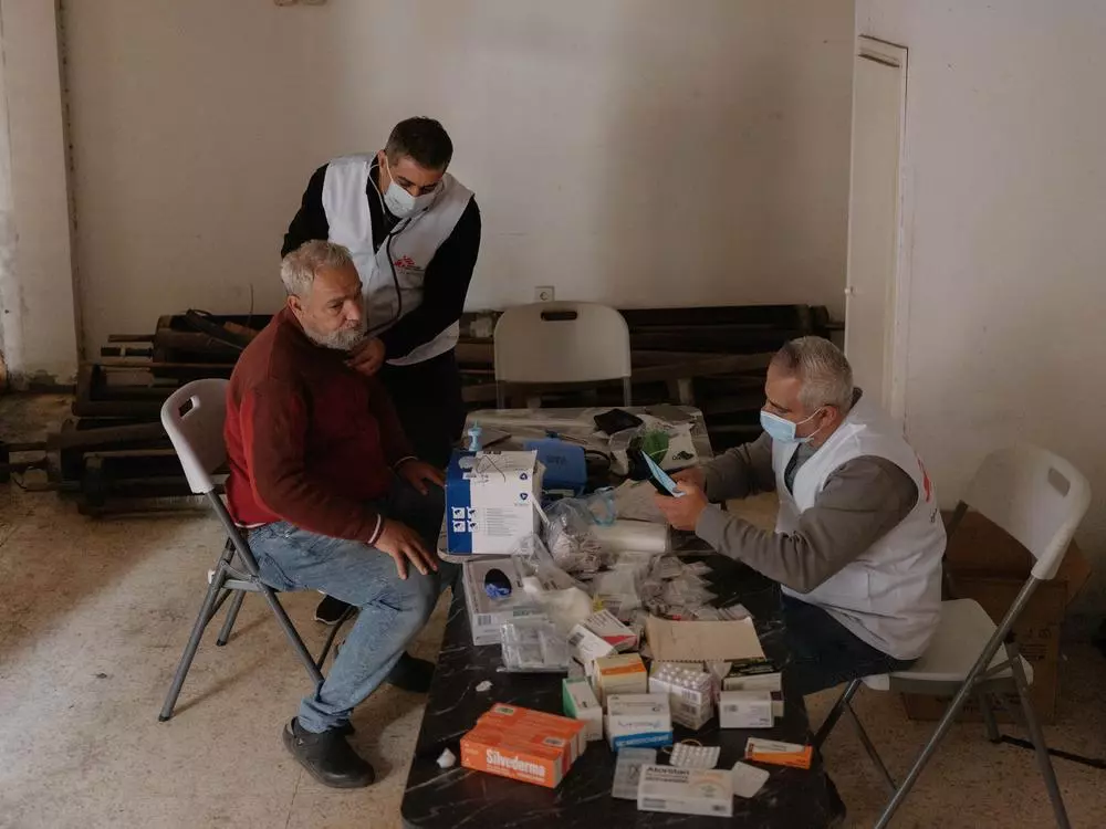 MSF staff with patient