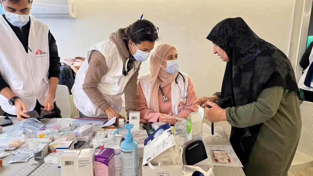 MSF staff talking to patient