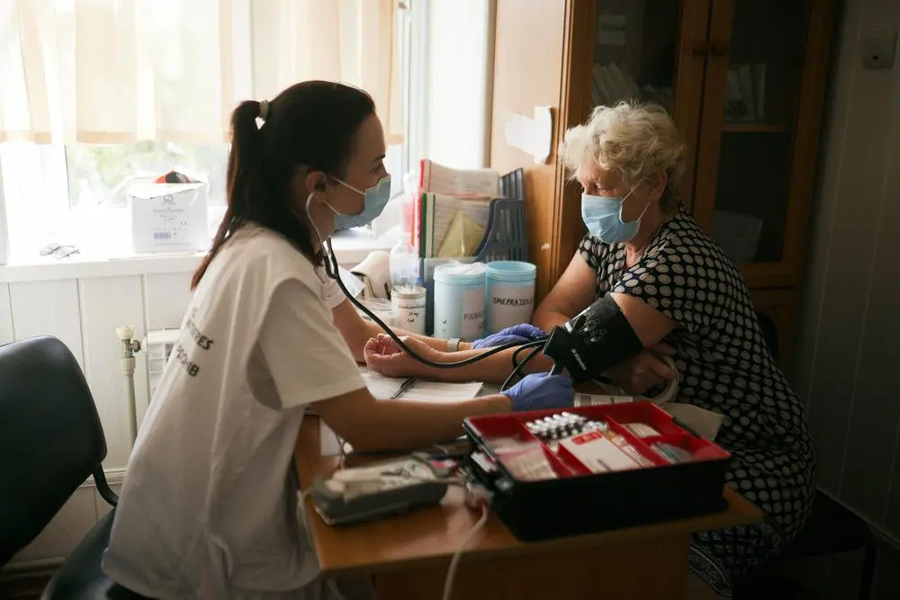 A 70-year-old patient attends a medical consultation during a Doctors Without Borders mobile clinic