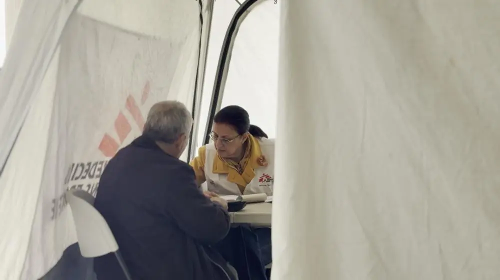MSF staff with patient