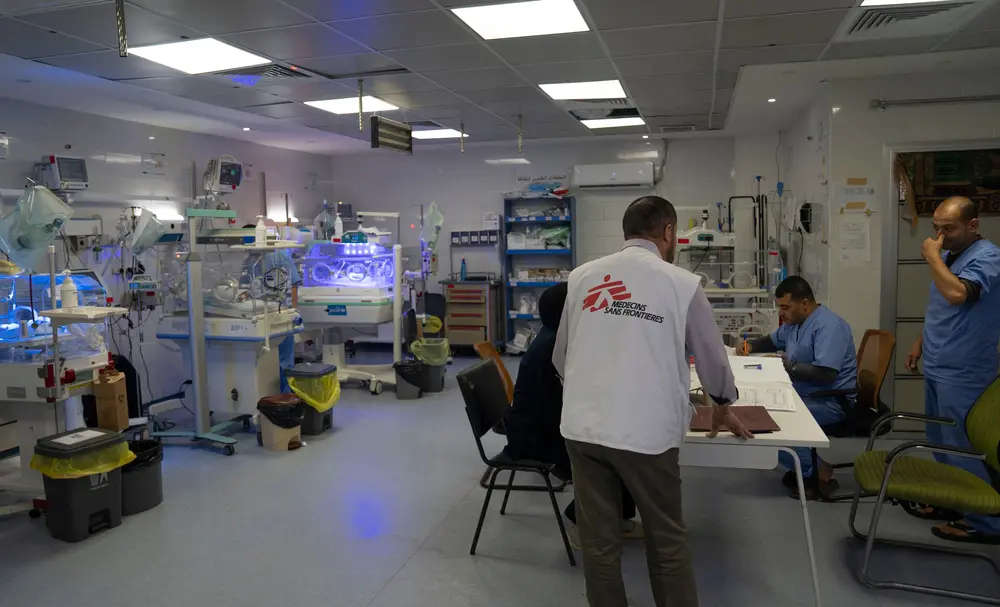 MSF staff check on patients
