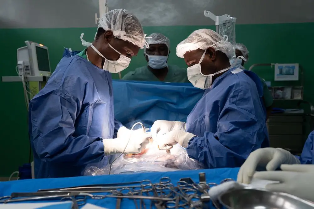 Surgeons cauterise a gunshot victim’s wound at the Rutshuru General Reference hospital. Democratic Republic of Congo