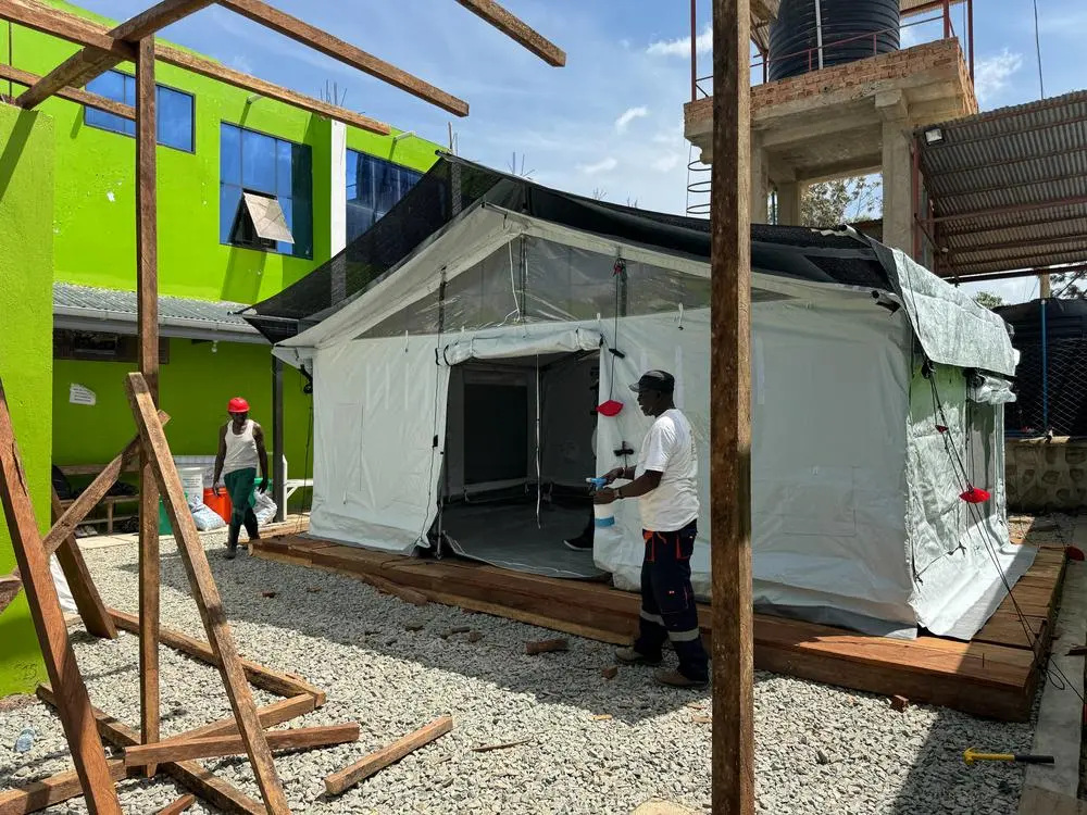 MSF teams setting up an isolation tent as part of the Ebola disease outbreak response