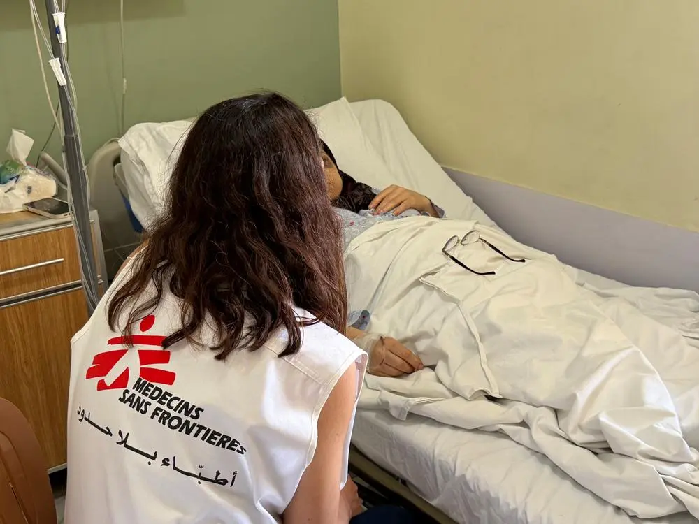 MSF staff talking to nurse