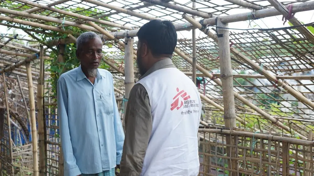 Rohingya patient talking with MSF staff